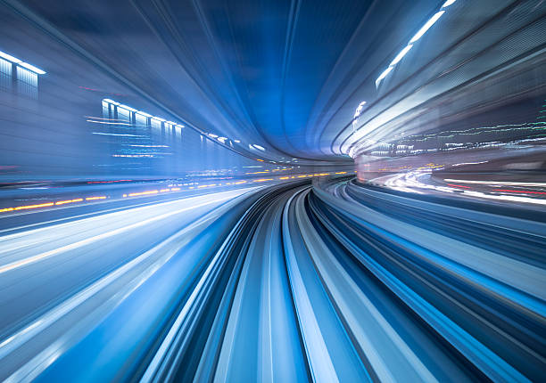 Motion blur of train moving inside tunnel in Tokyo, Japan stock photo