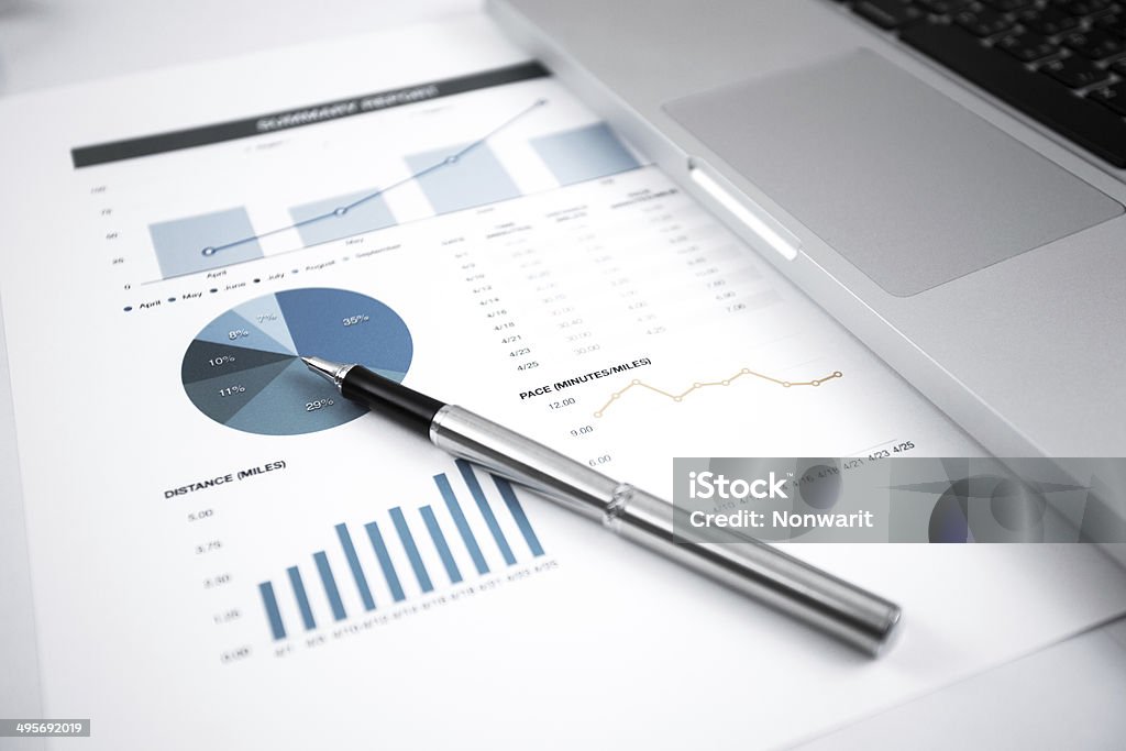 Businessman analyzing investment charts with laptop Businessman analyzing investment charts with laptop. Accounting Adult Stock Photo