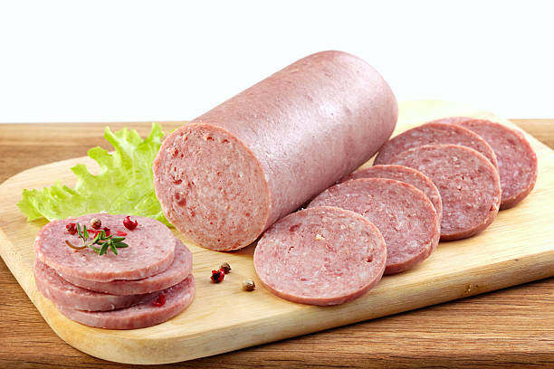 istock Salami sausage on wooden cutting board 495692076