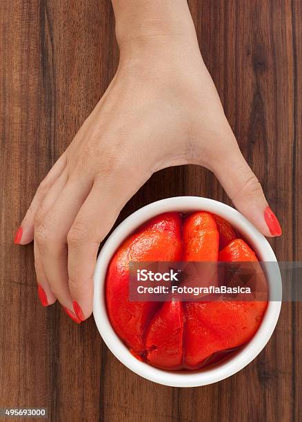 Offering Roasted Red Bell Peppers Stock Photo - Download Image Now - 2015, Adult, Adults Only
