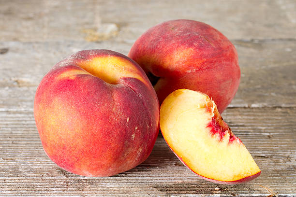 istock Ripe peaches whole and half of peach 495693906