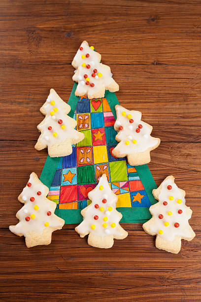 istock Christmas cookies, Christmas tree on wood 495694372