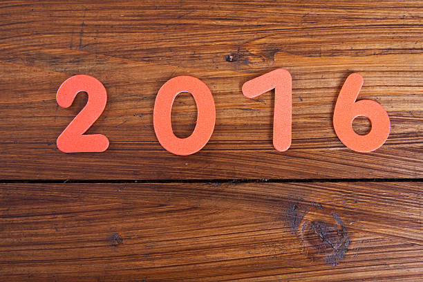 istock Year 2016, wooden background, copy space 495694632