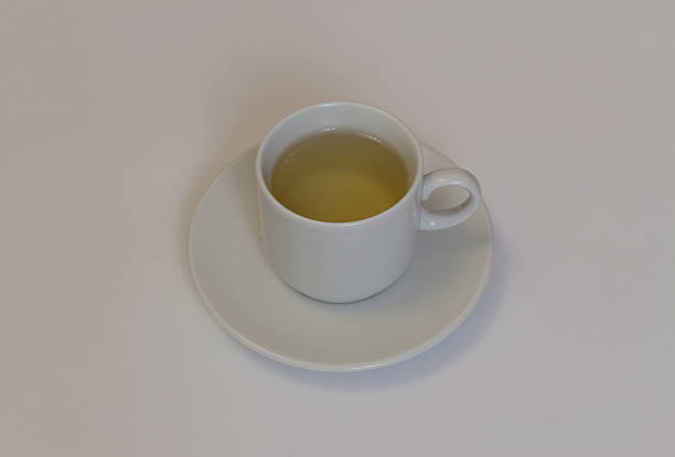 istock Cup of green tea on white background 495695010