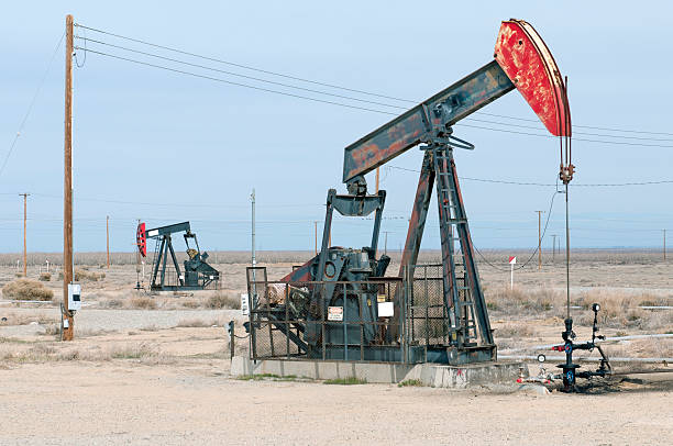 istock Pumpjacks pumping oil in rural Kern County CA 495695725