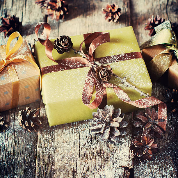 istock Christmas Boxes Decorated with Brown Ribbon, Pine cones 495696094