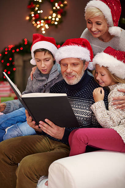 istock Children love when their father reads them 495696900