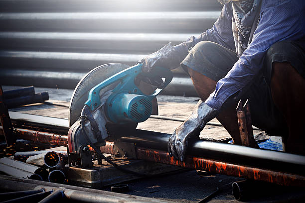 istock cutting steel with machine for cutting steel by worker 495697077