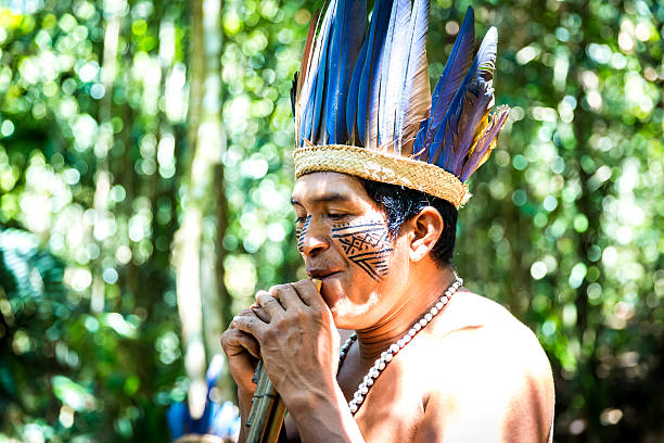 istock Native Brazilian playing wooden flute 495697084