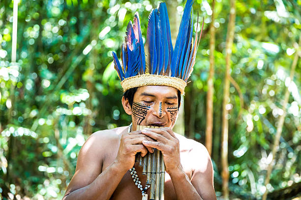 istock Native Brazilian playing wooden flute 495697300