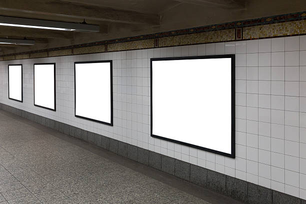 Four white blank billboards in the tunnel. stock photo