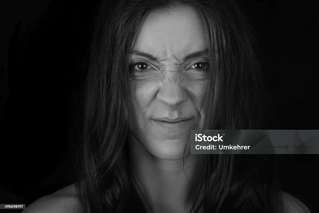 Women wrinkles her nose Black and white picture of a young women who wrinkles her nose. Wrinkled Stock Photo