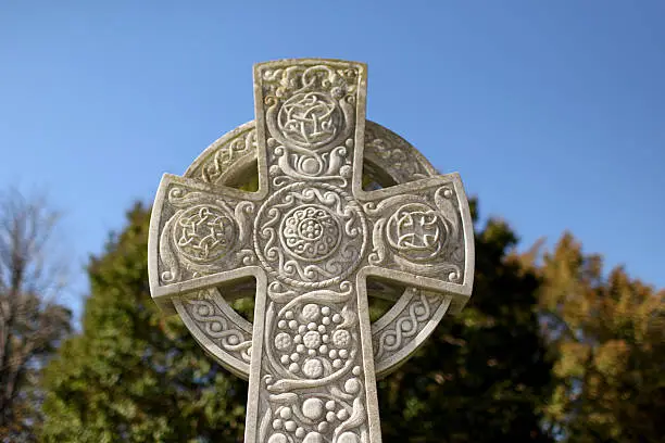 Celtic cross in a cemetery.