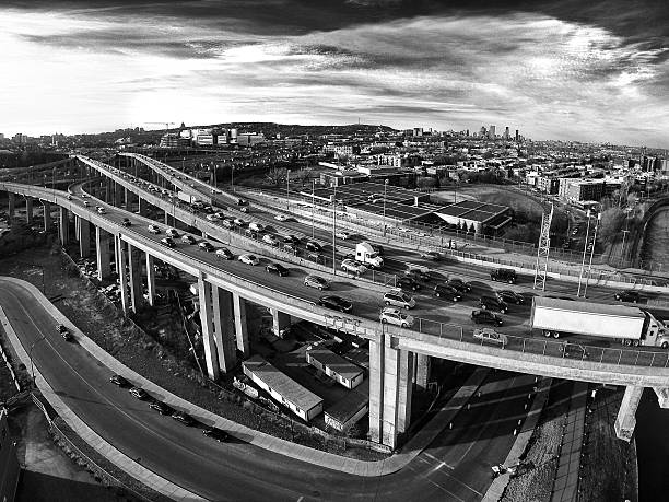 Traffic on highway in Montreal, Quebec, Canada with the aerial view on downtown and mountain