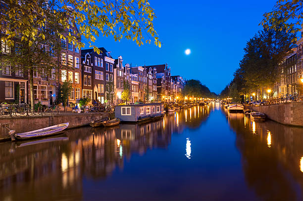 istock Houseboats on Amsterdam Canal at Night 495698267