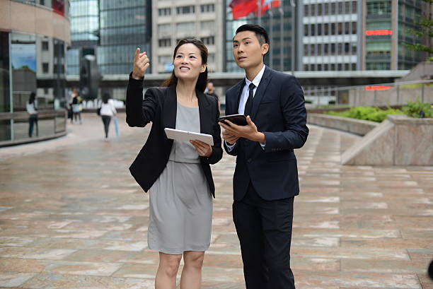 istock Asian business people in discussion 495698373