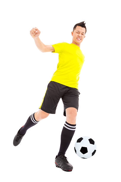 istock Soccer player kicking ball 495698869
