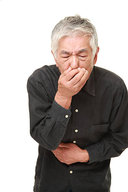 istock senior Japanese man feels like vomiting 495700480