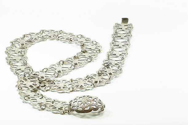 istock Old vintage lady silver belt on white background 495700566