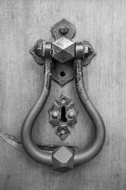 istock old style head knocker with wood door and key 495701993