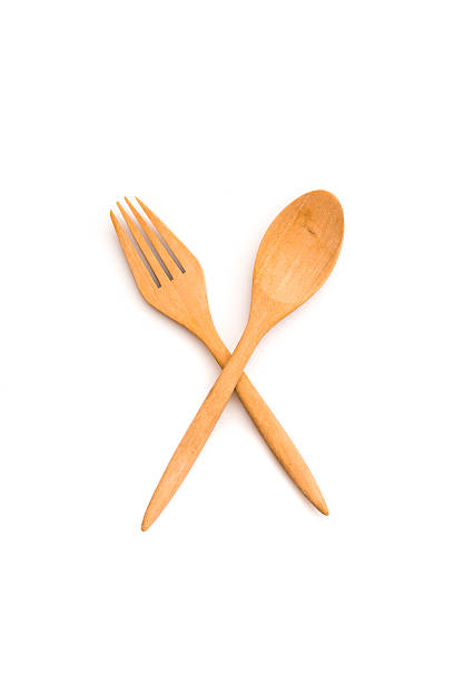 istock wooden spoon and fork on isolated background 495702258