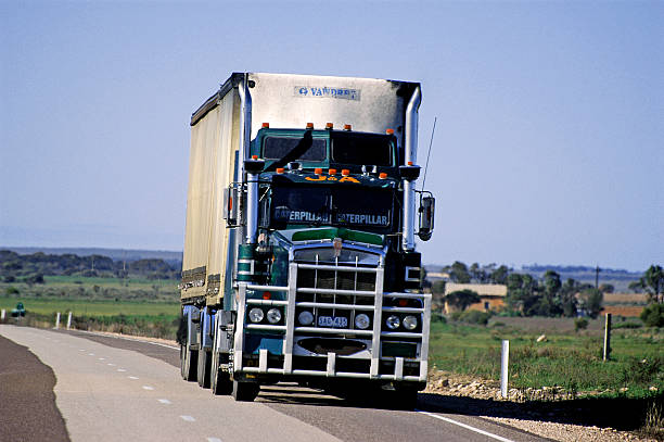 Semi trailer truck delivering freight on the highway