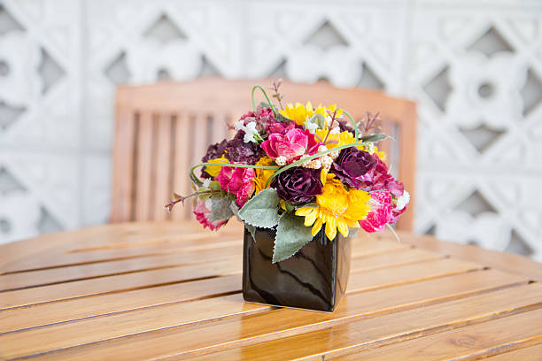 decorate flower on wooden table stock photo