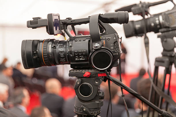 istock Filming an event with a video camera 495703254