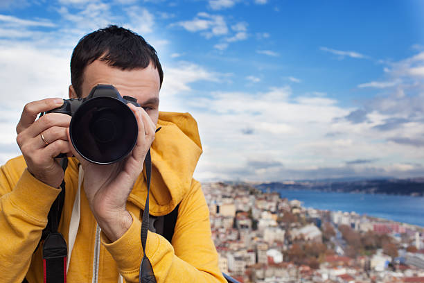 istock Tourist with camera take a picture 495715471