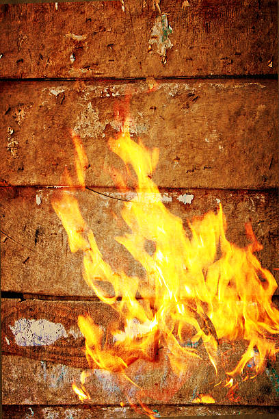 fire flame burns,wood plank background stock photo