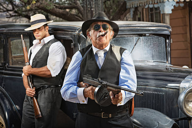 istock Mobster boss and guard with guns near black car 495717795