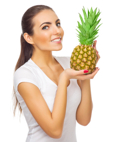 Young woman with pineapple isolated