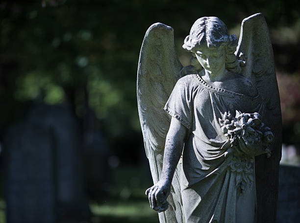 istock angel statue at the cemetery 495719153