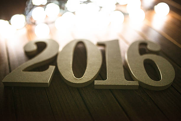 istock wooden 2016 New year text on christmas lights 495729048