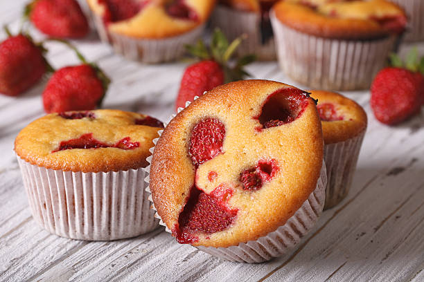 istock strawberry muffin macro on the table. Horizontal 495729346