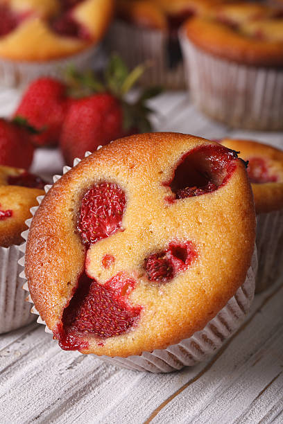 istock strawberry muffin macro on the table. vertical 495729788