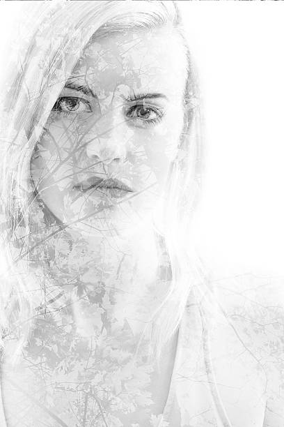 istock Young girl with leaves in black and white, double exposure 495732122