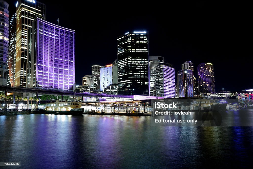 Circular Quay and Sydney CBD by night Sydney, Australia - May 28, 2014;  Circular Quay and the buildings of Sydney CBD by night during annual Vivid celebrations Architecture Stock Photo