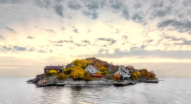 Island in autumn colors Island in swedish archipelago under sunset light and with autumn colors archipelago photos stock pictures, royalty-free photos & images