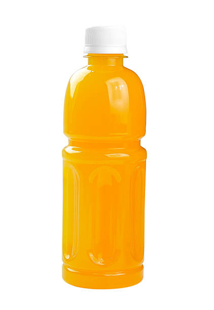 istock Plastic bottle and glass of orange juice 495735785