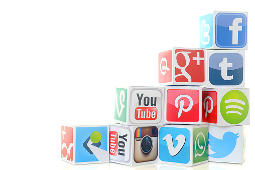 İstanbul, Turkey - November 5, 2015: Paper cubes with Popular social media services icons, including Facebook, Instagram, Youtube, Twitter on a white background.