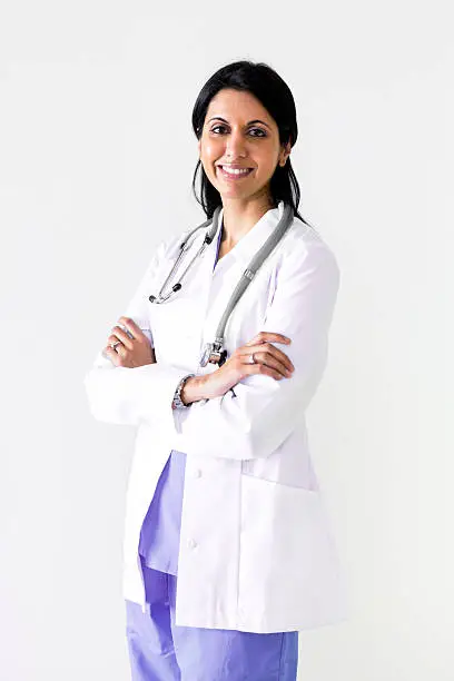 Female Doctor Wearing Lab Coat And Stethoscope Around Neck