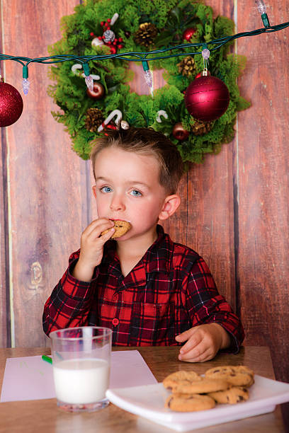 istock boy writing letter to Santa 495738358