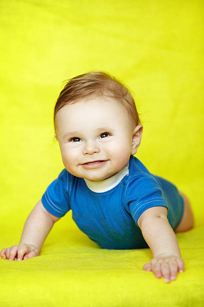 istock Baby boy crawling on his on knees 495740186