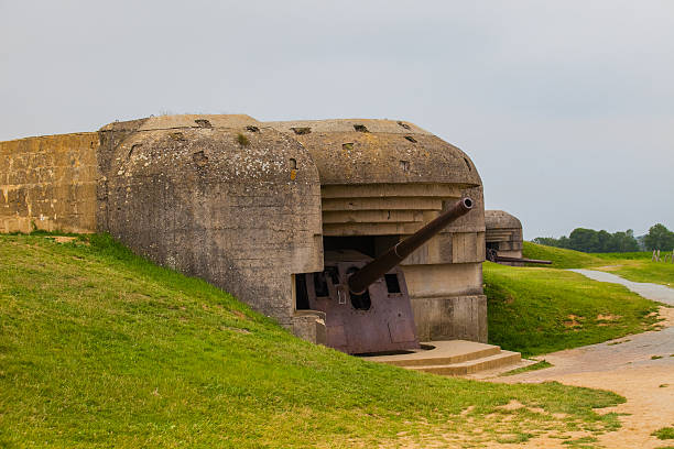 istock Old broken German bunkers of Atlantic Wall and artillery battery 495744493
