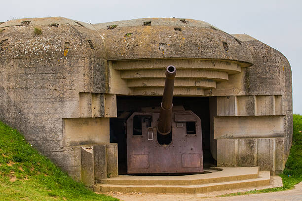 istock Old broken German bunkers of Atlantic Wall and artillery battery 495744495