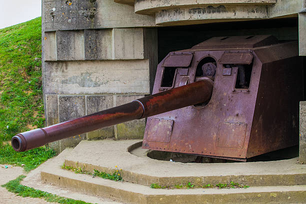 istock Old broken German bunkers of Atlantic Wall and artillery battery 495744497