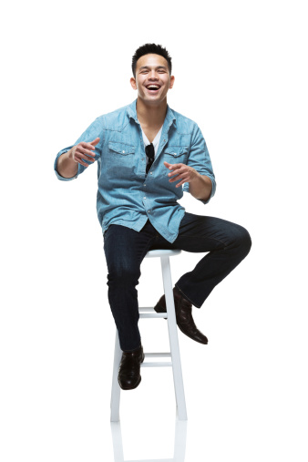 Front view of happy young man sitting on stoolhttp://www.twodozendesign.info/i/1.png