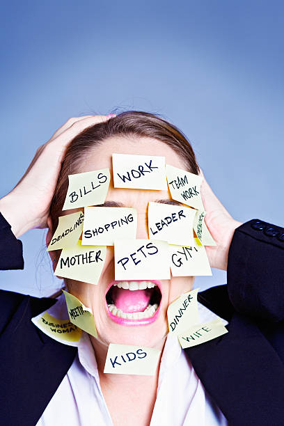 istock Overburdened woman covered in task reminders has had enough! 495746533