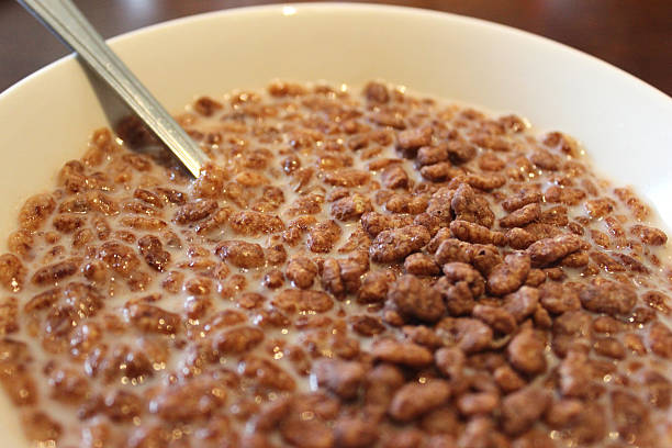 istock Cocoa rice krispies breakfast cereal in white bowl with milk 495747479